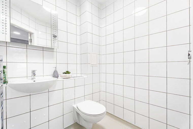 Interior of a white tiled shower room
