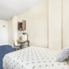 Interior view showing a single bed and study area