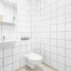 Interior view of the white tiled shower room