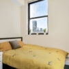 large bed by window