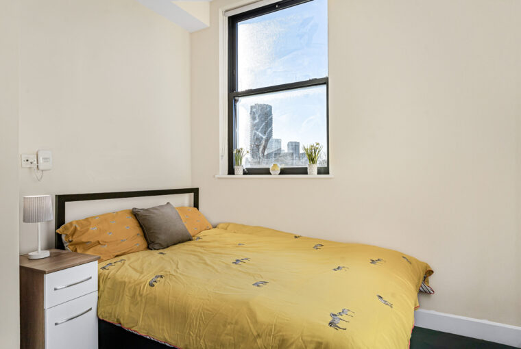 large bed by window